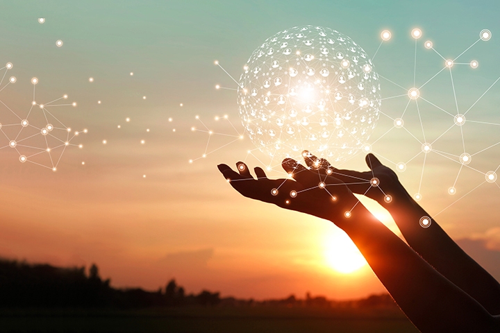 Person holding digital ball outdoors