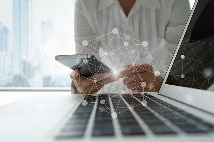 communication technology and connection concept. business people using mobile phone with wireless network icon.
