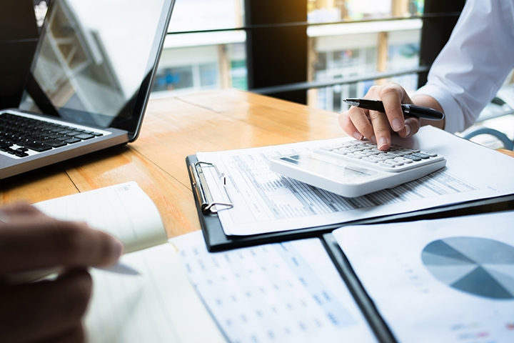 people in an office working on a finance related task
