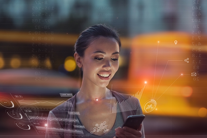 woman smiling looking at phone