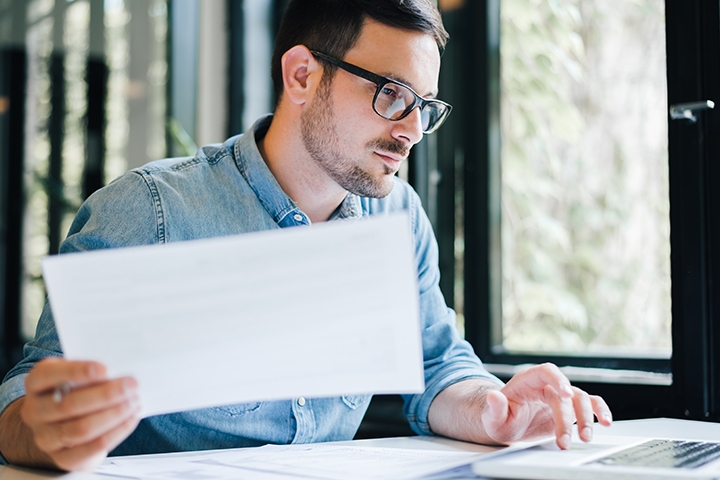 Thoughtful focused young casual businessman