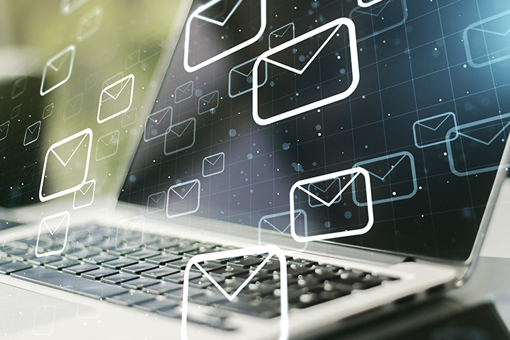 Floating mail icons in front of laptop