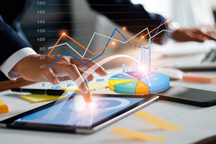 Businessman using tablet and laptop analyzing sales data and economic growth graph chart. Business strategy. Digital marketing. Business innovation technology concept