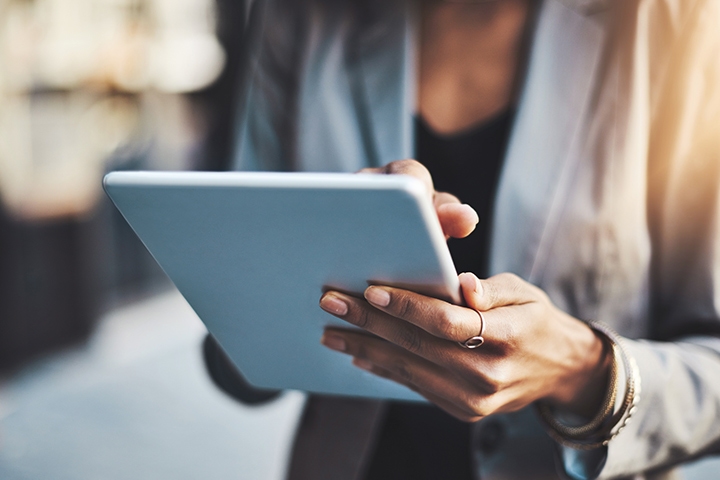 Closeup shot of a businesswoman using a digital tablet in the city