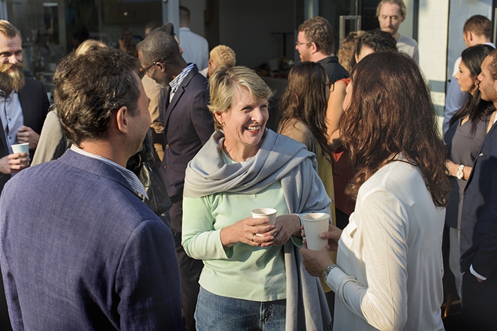 group of individuals smiling and conversation