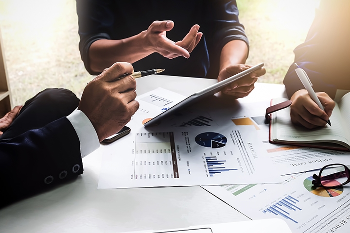 business people working in an office discussing a marketing plan