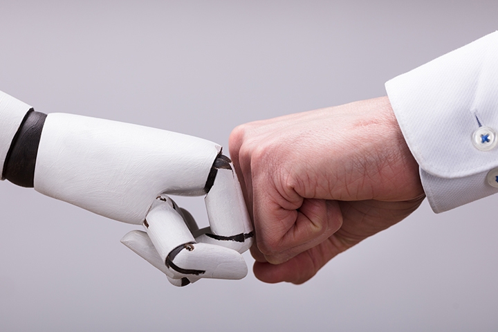 Robot and human fist bump