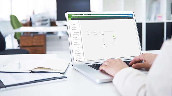 woman creating workflow on laptop 