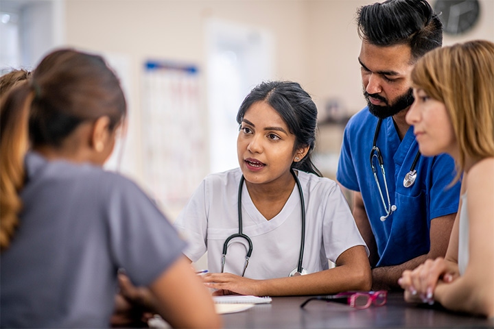 Doctors speaking in a hallway