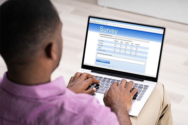 man completing online survey with pre-filled data fields man completing online survey with pre-filled data fields