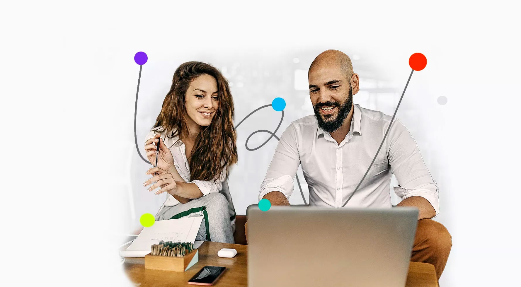 Two people doing accounting work on laptop