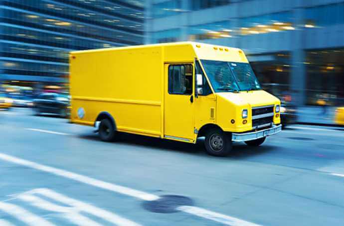a yellow parcel van on main street a yellow parcel van on main street