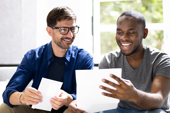 student parent smile read college admission letter 