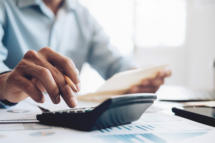 Person calculating invoice