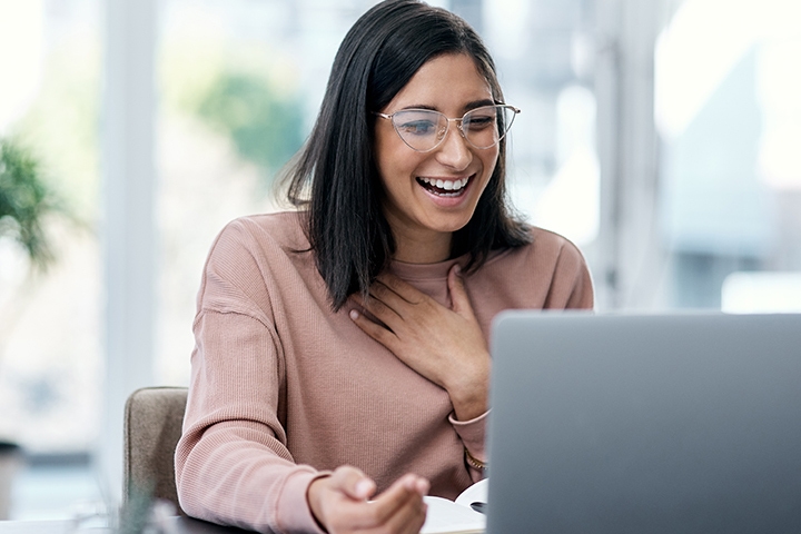 happy woman at a laptop