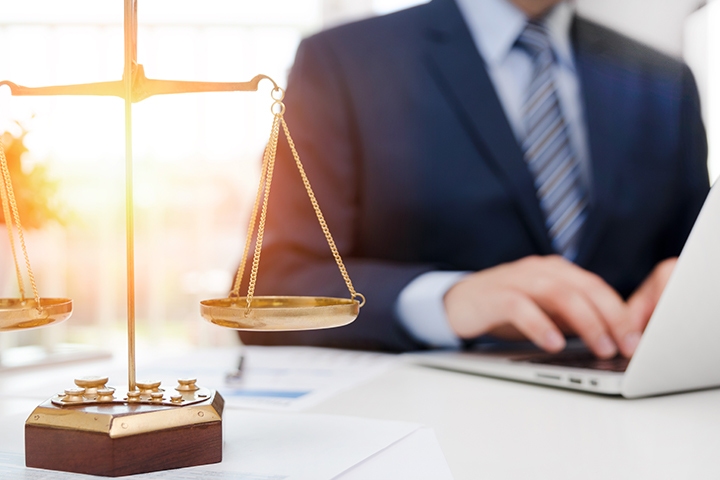 legal justice symbol weight scales on table attorney working in office