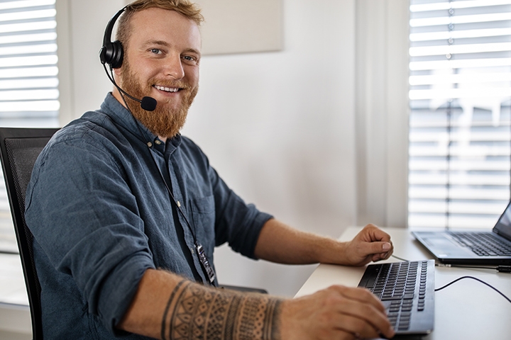 Man working in customer service at his desk