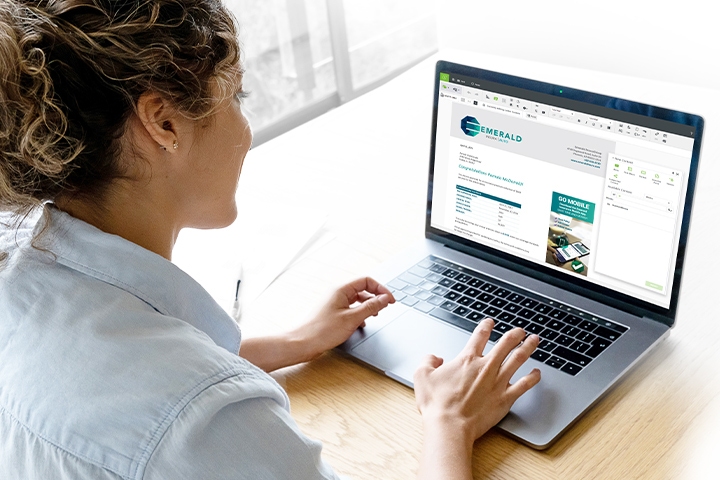 woman editing insurance claim summary document on laptop