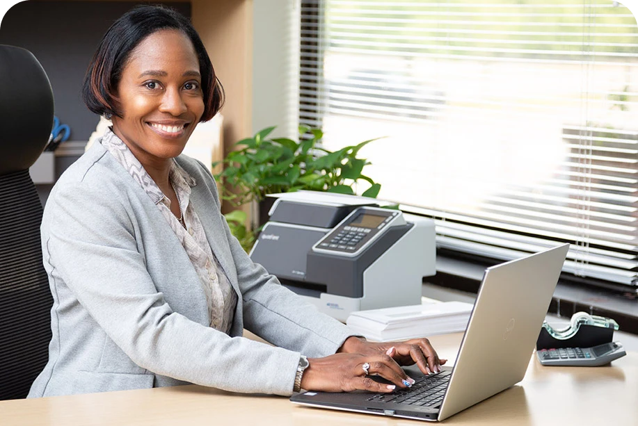 women working at her desk