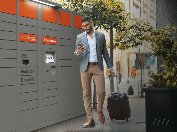 person with luggage next to a smart locker