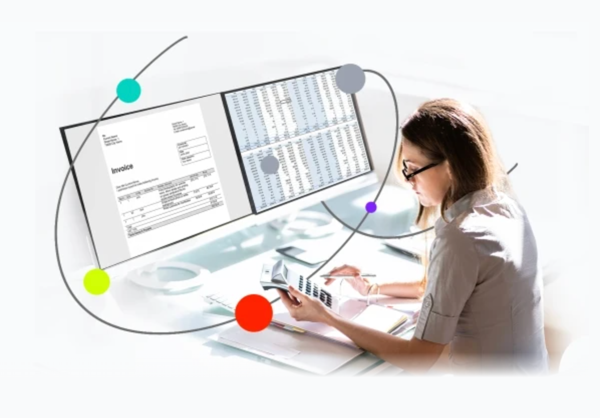 image of woman looking at a computer desktop evaluating invoices